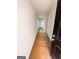 Long hallway with white walls, door and a dark accent door at 11598 E Lovejoy Rd # 3, Hampton, GA 30228