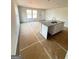 Kitchen featuring an island with sink, white cabinets, and granite countertops at 11598 E Lovejoy Rd # 3, Hampton, GA 30228
