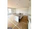 Spacious kitchen with a sink in the kitchen island and a big window at 11598 E Lovejoy Rd # 3, Hampton, GA 30228