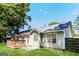 Back of house featuring a lush green lawn and wood deck at 1421 Oak Knoll Ne Dr, Conyers, GA 30012