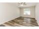 This bedroom is light and bright with luxury vinyl plank flooring and natural light at 1421 Oak Knoll Ne Dr, Conyers, GA 30012