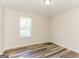 Bedroom featuring a bright, neutral-toned interior and luxury vinyl plank flooring at 1421 Oak Knoll Ne Dr, Conyers, GA 30012