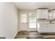 Modern kitchen area with white cabinets, sleek countertops, and updated appliances at 1421 Oak Knoll Ne Dr, Conyers, GA 30012