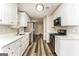 Stylish kitchen featuring stainless steel appliances, white cabinetry, and modern finishes at 1421 Oak Knoll Ne Dr, Conyers, GA 30012