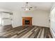 Open living space with a fireplace, vaulted ceilings, and lots of natural light at 1421 Oak Knoll Ne Dr, Conyers, GA 30012