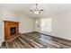Bright and airy living room featuring a fireplace and modern flooring at 1421 Oak Knoll Ne Dr, Conyers, GA 30012