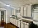 Well-lit kitchen with painted cabinets and stainless steel sink at 1829 Joy Lake Rd, Morrow, GA 30260