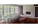 Comfortable living room with a cozy fireplace and large windows at 1829 Joy Lake Rd, Morrow, GA 30260