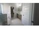 Bright bathroom showcases marble accents, dual sink vanity, a tub, and a separate shower area at 3368 Alhambra Cir, Hampton, GA 30228