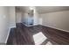 Spacious bedroom with dark hardwood floors, neutral walls, and lots of natural light at 3368 Alhambra Cir, Hampton, GA 30228
