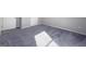 Bedroom featuring carpet floor, neutral walls, baseboard trim, and two bright doors at 3368 Alhambra Cir, Hampton, GA 30228