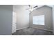 Bedroom with carpet floor, neutral walls, ceiling fan, and a window offering natural light at 3368 Alhambra Cir, Hampton, GA 30228