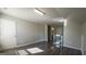 Bright bedroom with hardwood floors, neutral walls, door and staircase at 3368 Alhambra Cir, Hampton, GA 30228