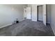 Bedroom with gray carpet and walls, showing a walk-in closet with ample storage space at 3368 Alhambra Cir, Hampton, GA 30228