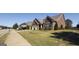 Suburban home boasting well-manicured lawns, mature trees, and neighboring houses along a peaceful street at 3368 Alhambra Cir, Hampton, GA 30228