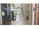 Bright, open foyer featuring tile floors, a modern staircase, and an aquarium at 3368 Alhambra Cir, Hampton, GA 30228