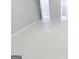 Hallway boasts sleek tiled floors and neutral paint, seamlessly connecting various rooms of the house at 3368 Alhambra Cir, Hampton, GA 30228