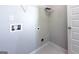 Functional laundry room with utility hookups and a wire rack at 3368 Alhambra Cir, Hampton, GA 30228