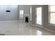 Bright living room boasts sleek tile flooring, a modern fireplace, and natural light from large windows at 3368 Alhambra Cir, Hampton, GA 30228