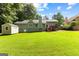 Well-maintained backyard with a storage shed and a patio, offering plenty of space for relaxation and activities at 431 Hampton Grn, Peachtree City, GA 30269