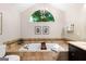 Travertine tub with an arched window at 431 Hampton Grn, Peachtree City, GA 30269