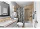 Well-maintained bathroom with shower-tub combo, granite countertop, and decorative storage baskets at 431 Hampton Grn, Peachtree City, GA 30269