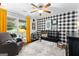 Bright bedroom with a crib, chair, black and white wallpaper, and colorful accents at 431 Hampton Grn, Peachtree City, GA 30269