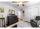 Well-lit bedroom with dresser, large closets, warm colors, and a cozy armchair at 431 Hampton Grn, Peachtree City, GA 30269