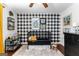 Charming bedroom featuring buffalo check accent wall, playful decor, and comfortable furnishings at 431 Hampton Grn, Peachtree City, GA 30269