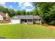 Inviting single-Gathering home with well-kept lawn, charming front porch, and a two-car garage at 431 Hampton Grn, Peachtree City, GA 30269