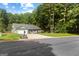 Well-maintained single-Gathering home with a lush lawn, front porch, and mature trees at 431 Hampton Grn, Peachtree City, GA 30269