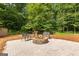 Cozy backyard fire pit area with seating, perfect for gatherings and enjoying the outdoors at 431 Hampton Grn, Peachtree City, GA 30269