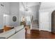 Grand foyer featuring hardwood floors, a staircase, and a chandelier, creating a welcoming entrance at 431 Hampton Grn, Peachtree City, GA 30269