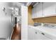 Convenient laundry room featuring modern washer and dryer and ample storage space at 431 Hampton Grn, Peachtree City, GA 30269
