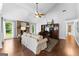 Cozy living room features a fireplace, high ceilings with fan, hardwood floors, and large windows at 431 Hampton Grn, Peachtree City, GA 30269