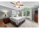 Spacious main bedroom with a ceiling fan, sitting area, and large windows providing ample natural light at 431 Hampton Grn, Peachtree City, GA 30269