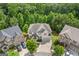 Stunning aerial view of a well-maintained home with a beautifully landscaped yard in a desirable neighborhood at 2307 Loughridge Dr, Buford, GA 30519