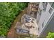 Aerial view of the home showcasing an outdoor patio, firepit, deck, and manicured yard for entertaining at 2307 Loughridge Dr, Buford, GA 30519