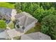 Beautiful aerial shot showcasing the roof and landscaping, located in a great location at 2307 Loughridge Dr, Buford, GA 30519