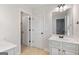 Bright bathroom features a double-sink vanity and a separate room with a toilet and shower at 2307 Loughridge Dr, Buford, GA 30519