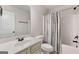 Clean bathroom with white vanity, toilet, and tub-shower featuring a patterned shower curtain at 2307 Loughridge Dr, Buford, GA 30519