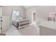 Cozy bedroom with crib, dresser, and white walls and carpet, creating a peaceful retreat at 2307 Loughridge Dr, Buford, GA 30519