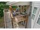 Inviting wooden deck with outdoor seating, perfect for relaxing and enjoying the view and summer days at 2307 Loughridge Dr, Buford, GA 30519