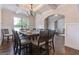 Elegant dining room with wainscoting, chandelier, and hardwood floors perfect for Gathering gatherings at 2307 Loughridge Dr, Buford, GA 30519