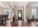 Welcoming foyer with hardwood floors, stylish accents, and a glimpse into the dining area at 2307 Loughridge Dr, Buford, GA 30519