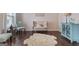 Cozy living room featuring hardwood floors, comfortable seating, and a neutral color palette at 2307 Loughridge Dr, Buford, GA 30519