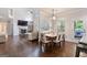 Open concept living room features a fireplace, hardwood floors, and direct access to kitchen at 2307 Loughridge Dr, Buford, GA 30519