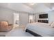 Bright primary bedroom featuring plush carpeting and an en suite bathroom at 2307 Loughridge Dr, Buford, GA 30519