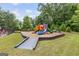Community playground featuring swings, slides, and climbing structures, perfect for outdoor fun at 2307 Loughridge Dr, Buford, GA 30519