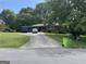 Lovely home with a long driveway, carport, and lush green front yard, perfect for suburban living at 537 Elizabeth Sw Ln, Mableton, GA 30126